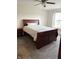 Comfortable bedroom featuring plush carpeting, ceiling fan, and a large window at 9671 Trail Dr, Avon, IN 46123