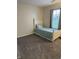 This bedroom features neutral walls, plush carpet, and a window with natural light at 9671 Trail Dr, Avon, IN 46123