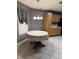 Cozy breakfast nook area in the kitchen, featuring tile floors and traditional cabinetry at 9671 Trail Dr, Avon, IN 46123