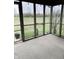Enjoy outdoor living in this screened porch with views of lush greenery at 9671 Trail Dr, Avon, IN 46123