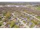 Aerial view of a neighborhood with mature trees, single-Gathering homes and community features at 9814 E 17Th St, Indianapolis, IN 46229