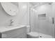 Updated bathroom features tiled shower with glass door and modern vanity at 9814 E 17Th St, Indianapolis, IN 46229