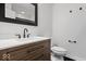 Updated bathroom features black hardware and modern vanity at 9814 E 17Th St, Indianapolis, IN 46229