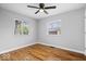 Bedroom features hardwood floors, neutral walls, and natural light at 9814 E 17Th St, Indianapolis, IN 46229