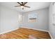 Bedroom features hardwood floors, neutral walls, and natural light at 9814 E 17Th St, Indianapolis, IN 46229
