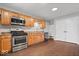 Kitchen featuring stylish oak cabinets, updated countertops, and modern stainless steel appliances at 9814 E 17Th St, Indianapolis, IN 46229
