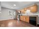 Kitchen featuring stylish oak cabinets, updated countertops, and modern stainless steel appliances at 9814 E 17Th St, Indianapolis, IN 46229