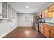 Kitchen featuring stylish oak cabinets, updated countertops, and modern stainless steel appliances at 9814 E 17Th St, Indianapolis, IN 46229