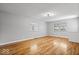 Bright living room with hardwood floors, white trim, and plenty of space for entertaining and relaxing at 9814 E 17Th St, Indianapolis, IN 46229