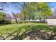 Expansive backyard with lush green grass and mature trees creating a private and serene outdoor space at 102 Florence Dr, Greenwood, IN 46143