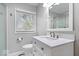 Bright bathroom featuring a single sink vanity and a glass-enclosed shower at 102 Florence Dr, Greenwood, IN 46143