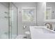 Updated bathroom featuring a modern vanity, toilet, and glass enclosed shower with tiled surround at 102 Florence Dr, Greenwood, IN 46143