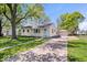 Charming single-Gathering home featuring a well-manicured front yard, a detached garage, and a concrete driveway at 102 Florence Dr, Greenwood, IN 46143