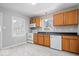 Bright, updated kitchen with stainless steel appliances, wood cabinets, and luxury vinyl tile flooring at 102 Florence Dr, Greenwood, IN 46143