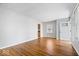 Spacious living room showcases gleaming hardwood floors and a neutral color scheme at 102 Florence Dr, Greenwood, IN 46143