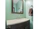 Classic bathroom showcasing a vanity with a light countertop, a dark wood cabinet, and stylish fixtures at 10883 Balfour Dr, Noblesville, IN 46060