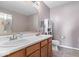 Functional bathroom featuring a double sink vanity, shower with glass door, and a white cabinet for storage at 10883 Balfour Dr, Noblesville, IN 46060