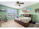 Comfortable bedroom featuring carpeted floors and natural light at 10883 Balfour Dr, Noblesville, IN 46060