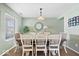 Traditional dining room with table, chairs, and a decorative light fixture at 10883 Balfour Dr, Noblesville, IN 46060