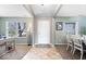 Bright and welcoming foyer with tile flooring, leading to a dining area, and a view to a sunlit window at 10883 Balfour Dr, Noblesville, IN 46060
