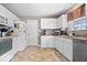 Bright and functional kitchen featuring white cabinets and modern stainless steel appliances at 10883 Balfour Dr, Noblesville, IN 46060