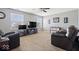Cozy living room featuring comfortable seating, entertainment center, and a ceiling fan at 10883 Balfour Dr, Noblesville, IN 46060
