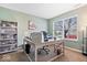 Inviting office space with neutral tones, built-in shelves, and a window that brings in plenty of natural light at 10883 Balfour Dr, Noblesville, IN 46060