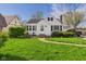 Charming single-Gathering home with tidy landscaping and a walkway leading to the front door at 1327 Lindberg Rd, Anderson, IN 46012
