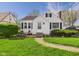 Charming single-Gathering home featuring tidy landscaping and a walkway leading to the front door at 1327 Lindberg Rd, Anderson, IN 46012