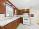 Cozy kitchen featuring tile floors, wood cabinets, and an abundance of natural light at 1327 Lindberg Rd, Anderson, IN 46012