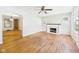 Bright living room featuring hardwood floors, a fireplace, and an abundance of natural light at 1327 Lindberg Rd, Anderson, IN 46012