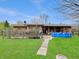 Spacious backyard featuring a well-maintained lawn, patio, and an above-ground pool at 1331 Dunlap Ave, Indianapolis, IN 46241