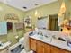 Well-lit bathroom with modern vanity, decorative lighting and tiled floors at 1331 Dunlap Ave, Indianapolis, IN 46241