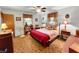 Comfortable bedroom with ceiling fan, wood floors, and ample natural light at 1331 Dunlap Ave, Indianapolis, IN 46241