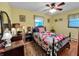 Cozy bedroom featuring a classic wood bed frame and warm, inviting colors at 1331 Dunlap Ave, Indianapolis, IN 46241