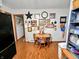 Dining area with wooden table and chairs adjacent to kitchen; decoratively adorned walls at 1331 Dunlap Ave, Indianapolis, IN 46241