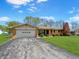 Well-maintained brick ranch-style home with attached garage and driveway at 1331 Dunlap Ave, Indianapolis, IN 46241