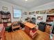Home office with desk, bookshelves, and natural light, perfect for work or study at 1331 Dunlap Ave, Indianapolis, IN 46241