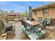 Backyard patio with a seating area, an umbrella, and a green and white patterned rug at 1331 Dunlap Ave, Indianapolis, IN 46241