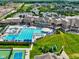 Community clubhouse with pool, tennis courts, and seating on meticulously landscaped grounds at 1333 Chatham Rdg Ct, Westfield, IN 46074