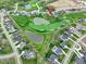 Aerial view shows the property's location on a golf course with scenic ponds and manicured greens at 1333 Chatham Rdg Ct, Westfield, IN 46074
