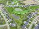 Aerial view showcases the surrounding community, golf course, and ponds, highlighting its prime location at 1333 Chatham Rdg Ct, Westfield, IN 46074