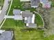 Aerial shot of the home with a metal roof, a driveway, landscaping, and well-maintained lawn at 1333 Chatham Rdg Ct, Westfield, IN 46074