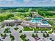 Stunning aerial view of community clubhouse, pool, tennis courts, and manicured green golf course at 1333 Chatham Rdg Ct, Westfield, IN 46074