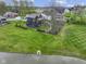 A view from the water's edge showcases the home's backyard, landscaping, and position by the water at 1333 Chatham Rdg Ct, Westfield, IN 46074