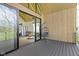 Covered patio with wooden floors, a hanging chair, and sliding glass doors leading inside at 1333 Chatham Rdg Ct, Westfield, IN 46074