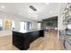 Finished basement featuring a large island bar, additional seating, and a wet bar with modern finishes and lighting at 1333 Chatham Rdg Ct, Westfield, IN 46074