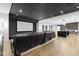 Finished basement featuring a large projection screen, comfortable seating, and hardwood floors, perfect for entertainment at 1333 Chatham Rdg Ct, Westfield, IN 46074