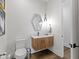Bathroom with a modern vanity, stylish mirror, and toilet at 1333 Chatham Rdg Ct, Westfield, IN 46074