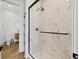 Stylish bathroom showcasing a glass shower with marble walls and modern fixtures at 1333 Chatham Rdg Ct, Westfield, IN 46074